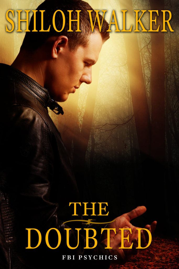 FBI Psychics 7 - A good looking guy at night, staring down at his hands.
