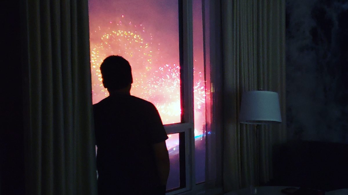 The guy watching Niagara Falls, silhouetted against the window
