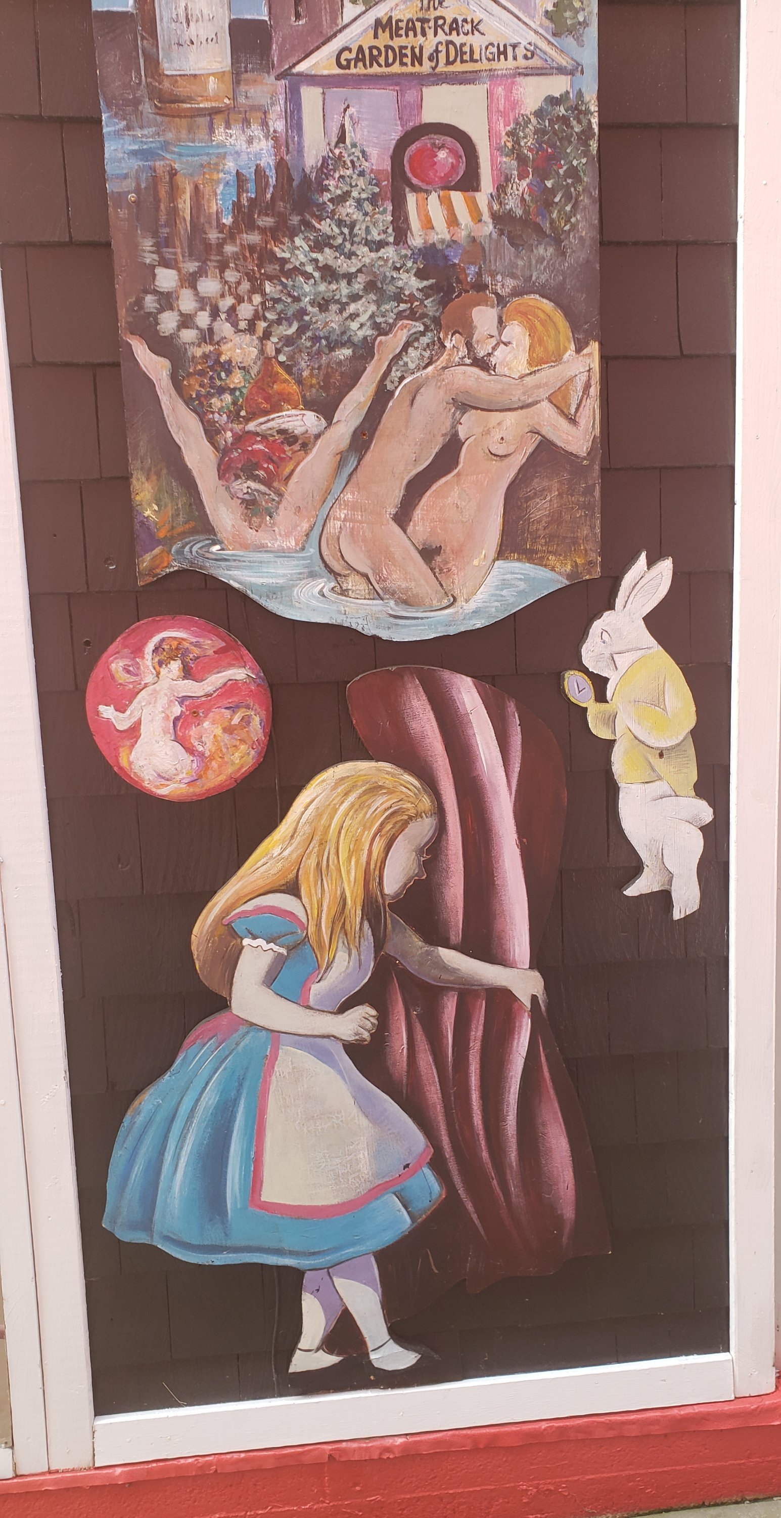 Art seen in an alley in Provincetown. Alice in Wonderland, and a few unrelated explicit offerings