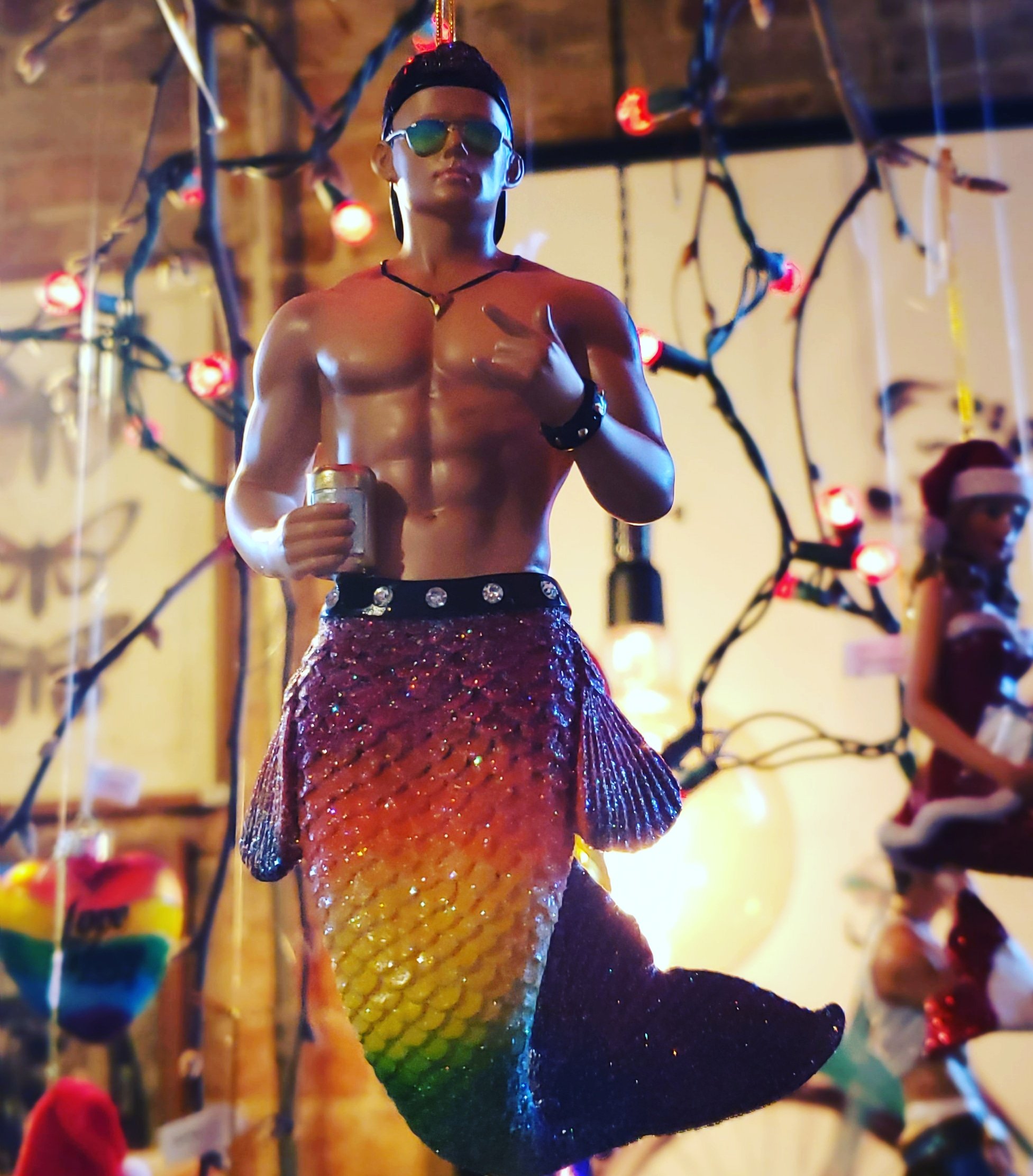 Merman with pride-colored tail & black baseball cap